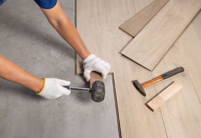 Worker Installing Interlocking laminate floor, home renovation